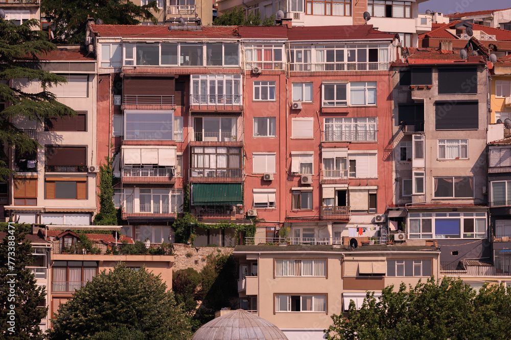 Beautiful houses and city streets of the southern city with green plants, public place in Turkey, on a summer sunny day Beautiful houses and city streets of the southern city with green plants, public place in Turkey, on a summer sunny day