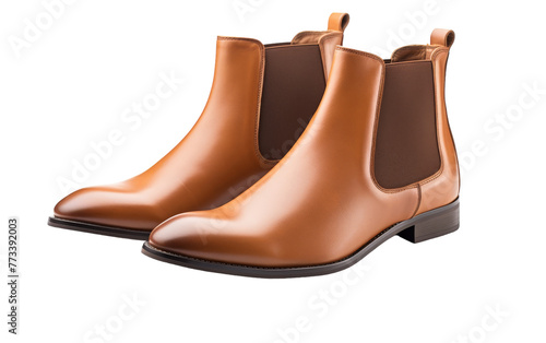 A stylish pair of brown Chelsea boots standing elegantly on a white background
