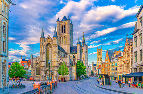 Ghent city historical center with Saint Nicholas Church on Korenmarkt Wheat Market square, Belfry Het Belfort van Gent and row of colorful buildings, East Flanders province, Flemish Region, Belgium photo