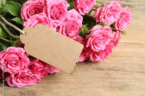 Happy Mother's Day. Beautiful flowers and blank card on wooden table