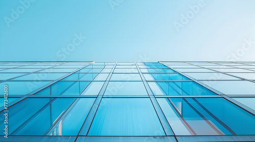 Modern Glass Building Facade Under Blue Sky
