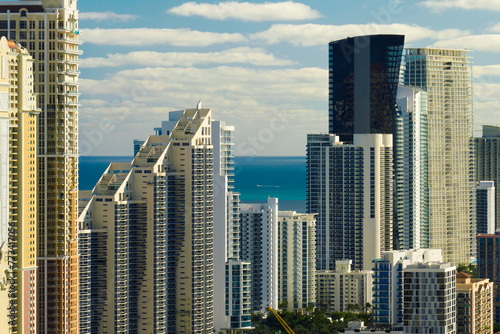 Expensive highrise hotels and condos on Atlantic ocean shore in Sunny Isles Beach city. American tourism infrastructure in southern Florida
