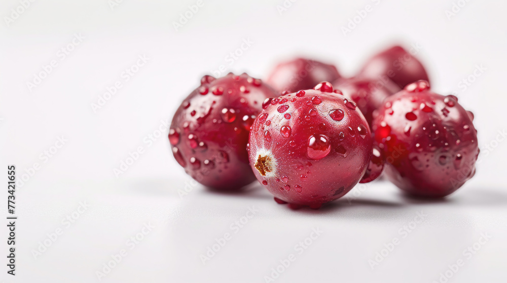 Red berries with water drops on white background Red berries with water drops on white background