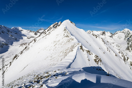 Mala Basta mountain, view from Patria, Vysoke Tatry, High Tatras, Slovakia. Landscape scenery of beautiful peak, summit and top. Nature in the winter. Sunny day with blue sky and white snow.