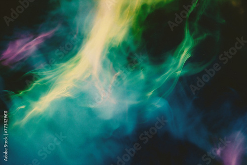 Abstract art. Colorful smoke from vape on a black background