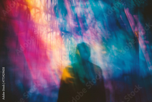 abstract blurred photo of a man walking in the city at night photo