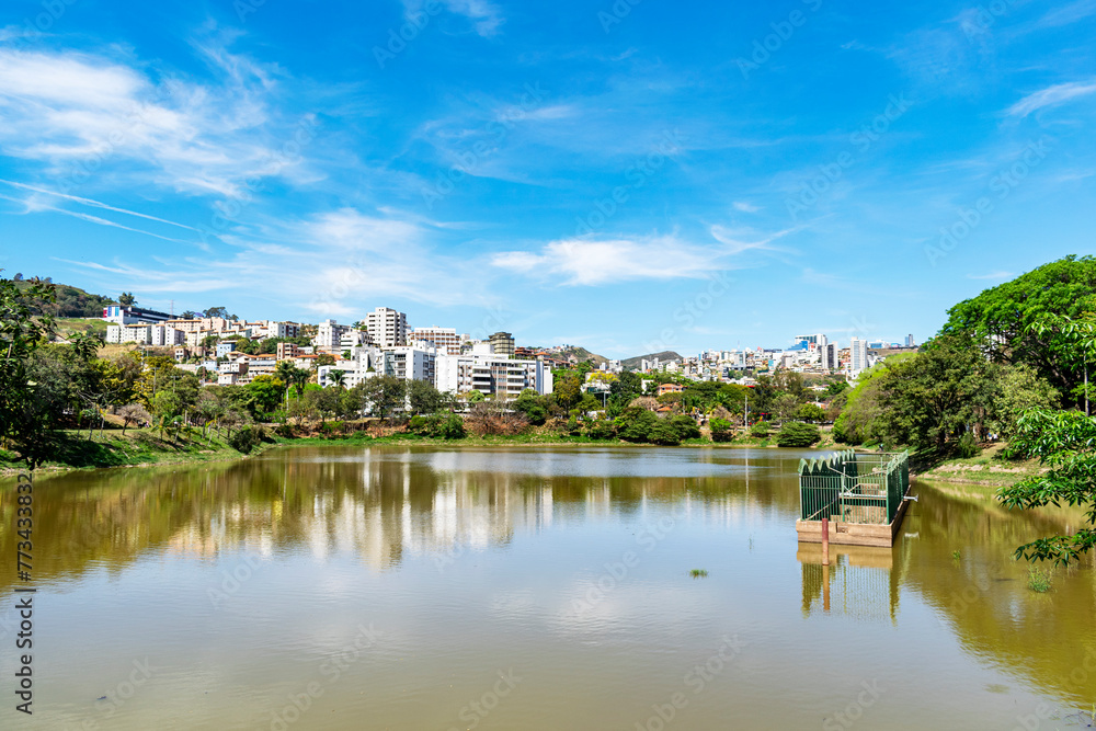 Residential buildings on the edge of a lake with many trees. Blue sky with clouds. City of Belo Horizonte. Brazil Residential buildings on the edge of a lake with many trees. Blue sky with clouds. City of Belo Horizonte. Brazil