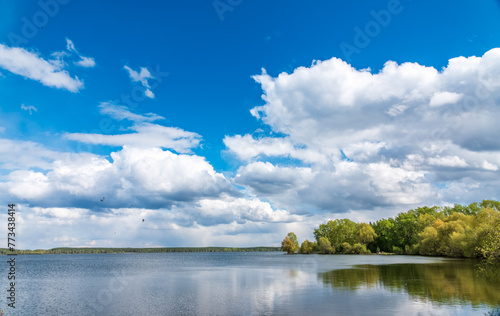 Blue lake with cloudy sky, natural background