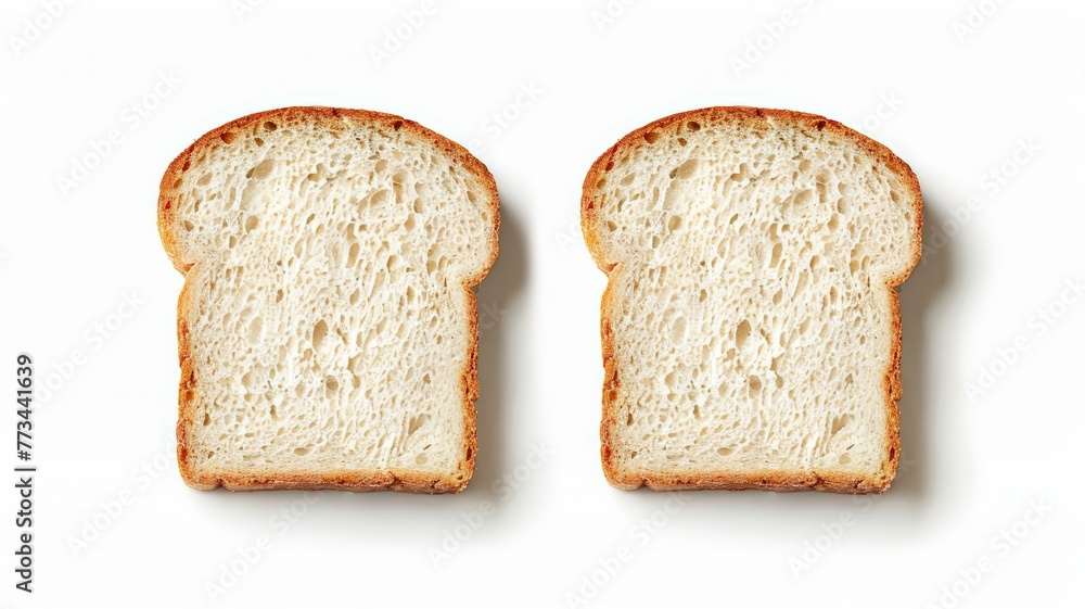 Two slices of white bread resting on a white surface Two slices of white bread resting on a white surface
