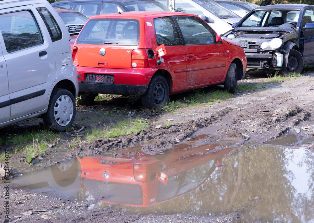 Junkyard in Holland with old and broken cars and photos of carparts