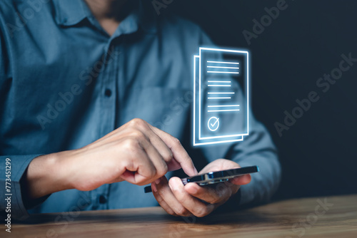 innovation, information, marketing, internet, mobility, technology, working, financial, smartphone, media. A man is using a cell phone to sign a document. Concept of modern technology and the ease.