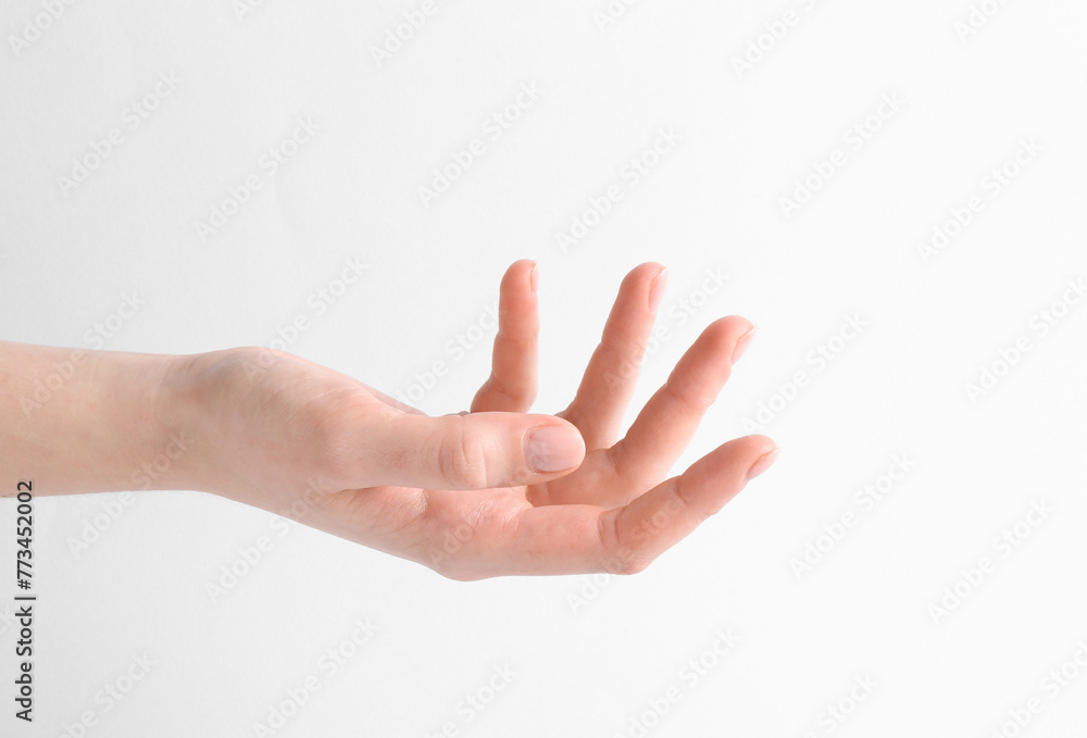 Naklejka premium Woman holding hand on white background, closeup