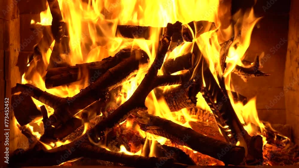 A fire burning in fireplace. the concept of home comfort A fire burning in fireplace. the concept of home comfort