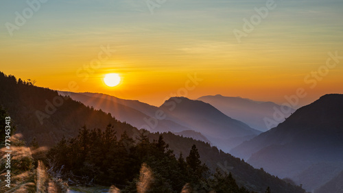Fototapeta Naklejka Na Ścianę i Meble -  A captivating sunrise scene in late winter at the observation deck of National Taipingshan Forest Recreation Area, Ilan county, northeastern Taiwan.