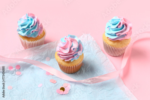 Three vanilla cupcakes with...