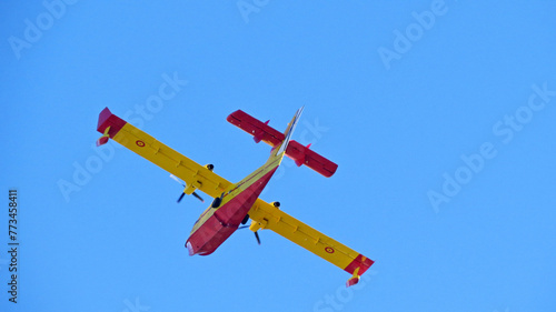 fire extinguisher plane yellow red canadair wing 43 fire flying cl-415 blue sky background