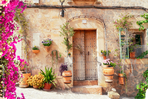 wall with traditional flower pots in old town of Valdemossa, Majorca, Spain