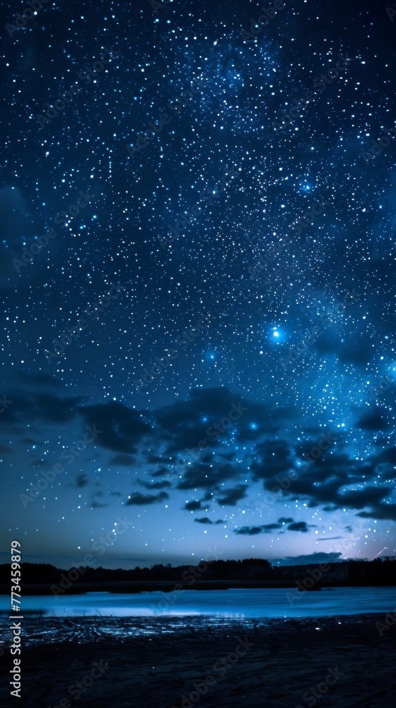A starry sky adorned with wispy clouds, gently veiling the celestial expanse. A starry sky adorned with wispy clouds, gently veiling the celestial expanse.