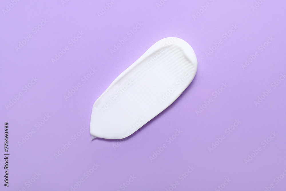 Sample of cosmetic cream on lilac background Sample of cosmetic cream on lilac background