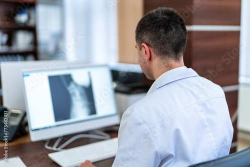 Doctor working in modern hospital office. Computer medical healthcare specialist.