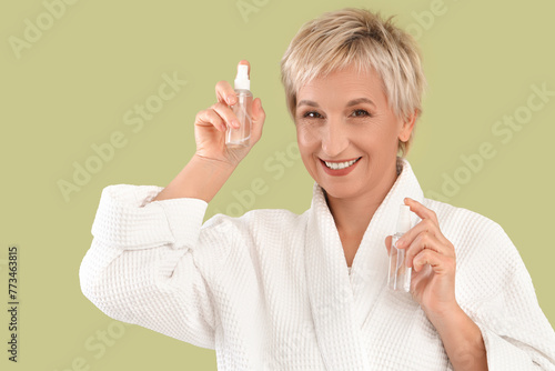 Mature woman with spray bot...