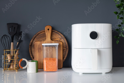 White Mini Air Fryer for Cooking WIthout Oil. Concept of White Kitchen Healthy Cooking