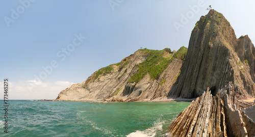 flysch rock formation at Itzurun beach at Zumaia coast, Pais Vasco Spain photo