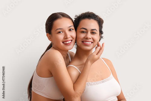 Happy young women on white ...