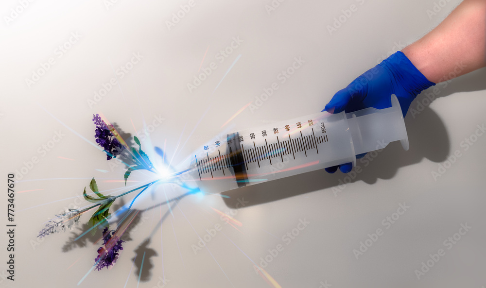 A syringe with flowers. Homeopathy concept.1