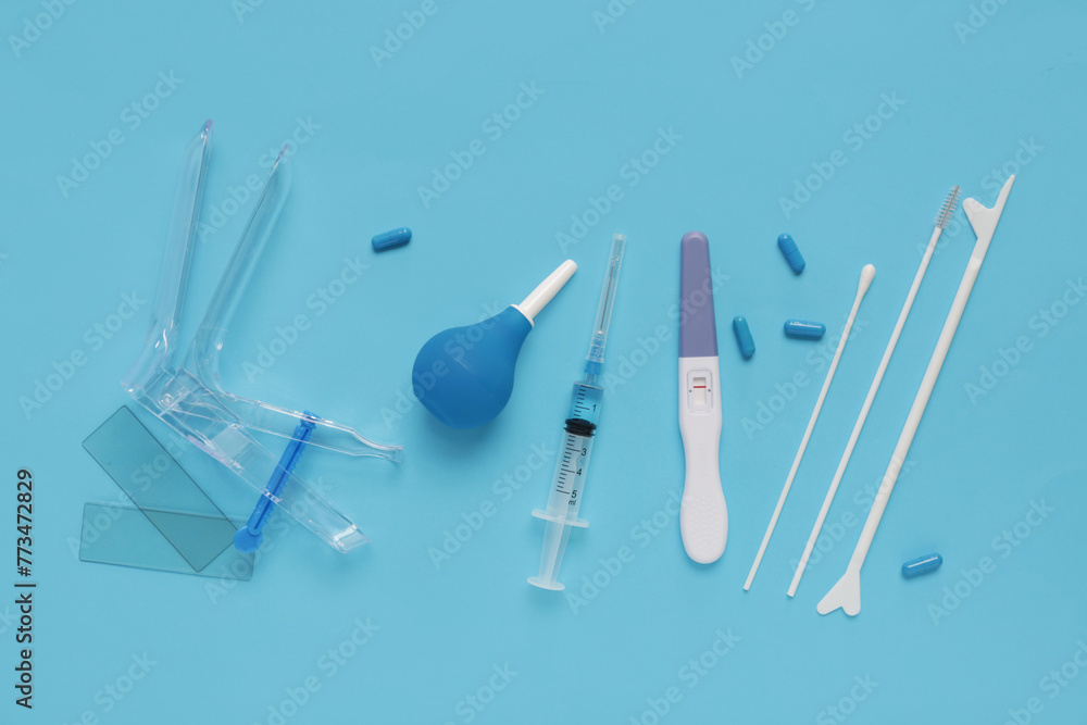 Gynecological speculum with pap smear test tools, pregnancy test and
