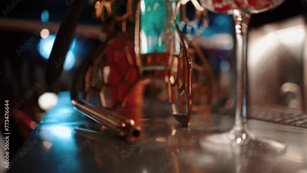 Beautiful hookah with neon lighting in a nightclub in a relaxing atmosphere. Smoking at a party in a dark restaurant Beautiful hookah with neon lighting in a nightclub in a relaxing atmosphere. Smoking at a party in a dark restaurant