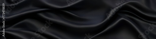 Black panoramic silk background, fabric with blurred satin wavy texture. 