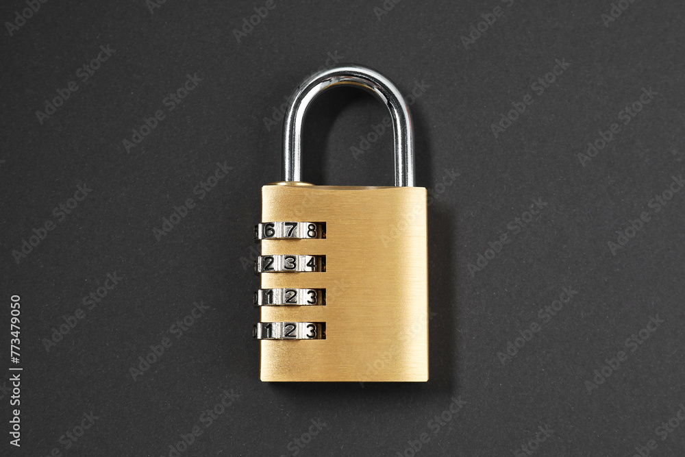 One steel combination padlock on black background, top view One steel combination padlock on black background, top view