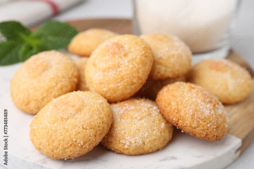 Tasty sweet sugar cookies on table, closeup