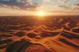 A beautiful sunset scene over the sand dunes. Perfect for travel and nature concepts