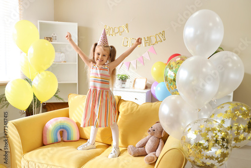 Cute little girl standing o...