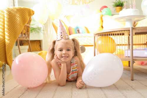 Cute little girl in party h...