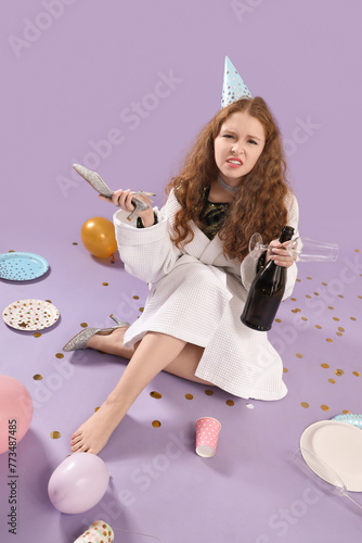 Young woman with hangover a...