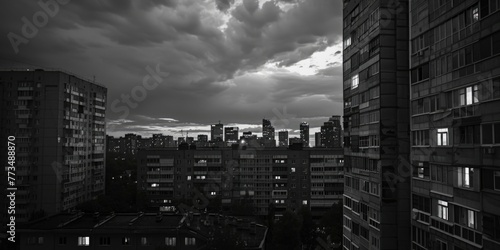 A black and white photo of a city at night. Suitable for urban themes