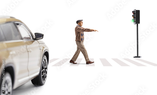 Full length profile shot of an elderly man sleepwalking at a street in front of a vehicle photo
