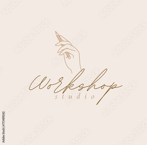 Hand holding pencil with lettering workshop studio drawing in linear style on beige background