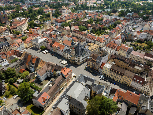 Aerial view of the old town of Altenburg Thuringia in summer. Market square with town hall, red tips, large pond, art tower and fountain in the pond.