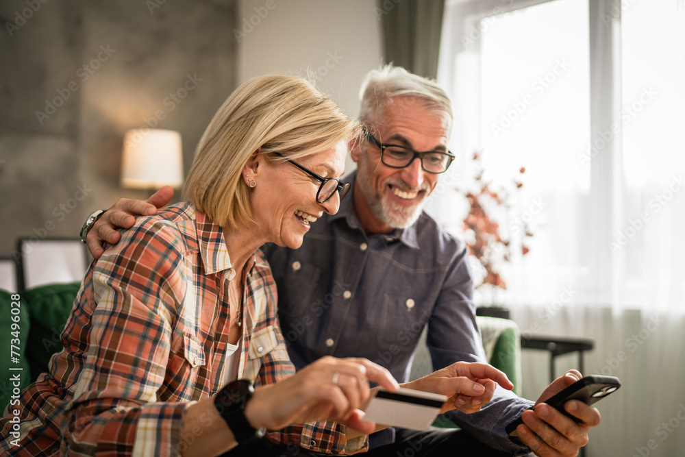 mature or senior couple husband and wife shopping online sit at home mature or senior couple husband and wife shopping online sit at home