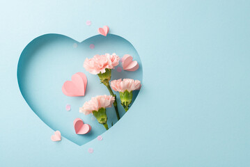 Mother's Day sophistication theme. Top view of lush cloves, hearts, and elegant confetti, displayed within heart-shaped cutout on refined blue background, perfect for conveying thoughtful messages