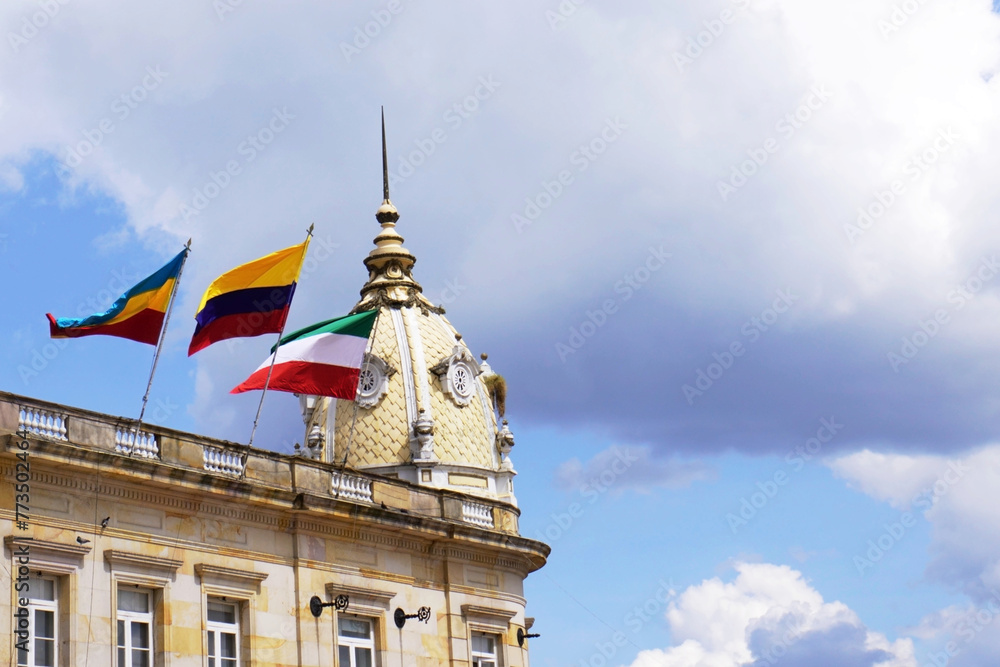 Flags of Colombia and Zipaquirá waving from one of the domes of the diocesan cathedral of Zipaquirá.
