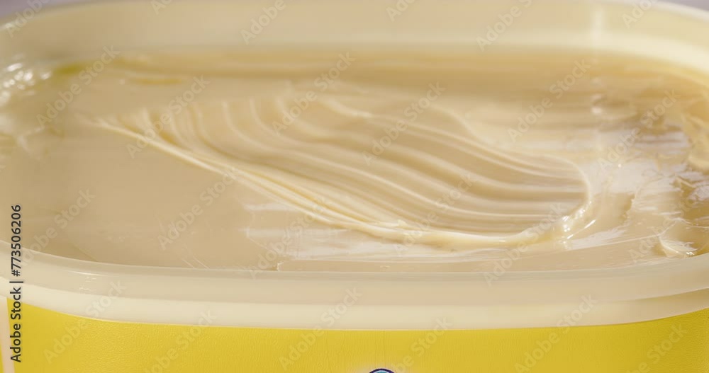 Sandwich butter is taken with a piece of bread Sandwich butter is taken with a piece of bread
