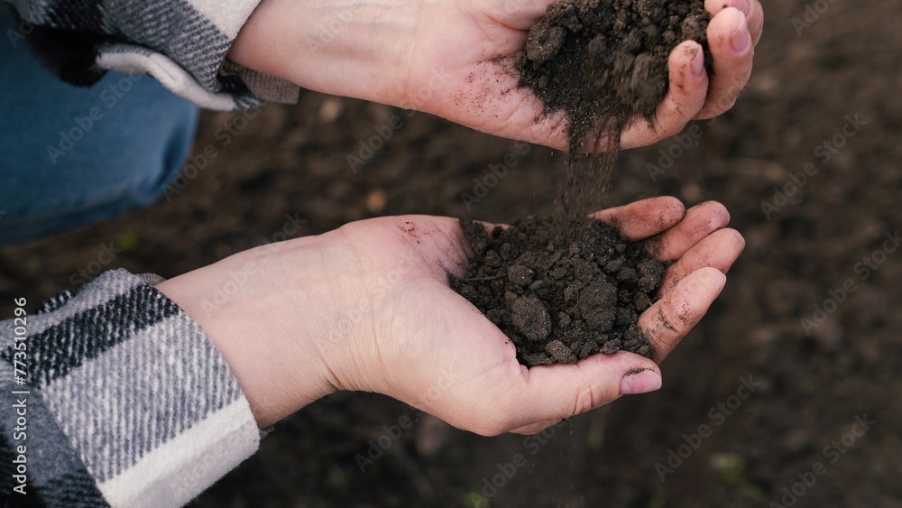 woman farmer pours environmentally friendly soil hands, touching soil field with fingers, farmer organic gardening engineer, growing seeds, growing vegetables field farm, business, hands soil close-up