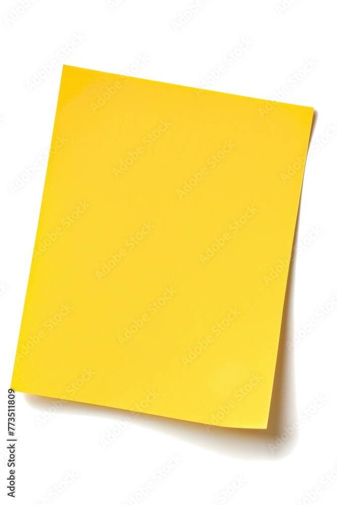 A yellow sticky paper on a plain white surface. Ideal for office or school related designs A yellow sticky paper on a plain white surface. Ideal for office or school related designs