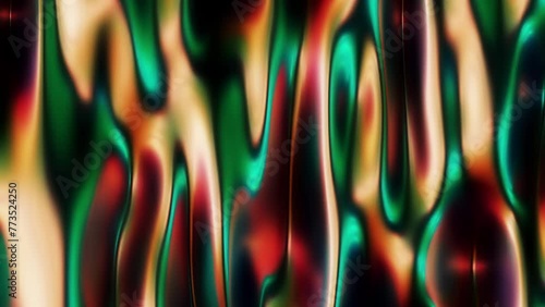 Abstract, fluid and colorful 3D metallic seamless loop animation. Modern and contemporary feel in 4K. Metallic, iridescent and reflective with shades of green, yellow, red, orange, black