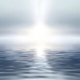 Radiant light beam shining down on calm body of water, creating a soothing and peaceful atmosphere.